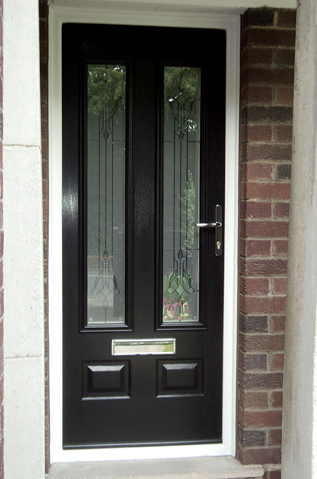 Black composite door with a white frame