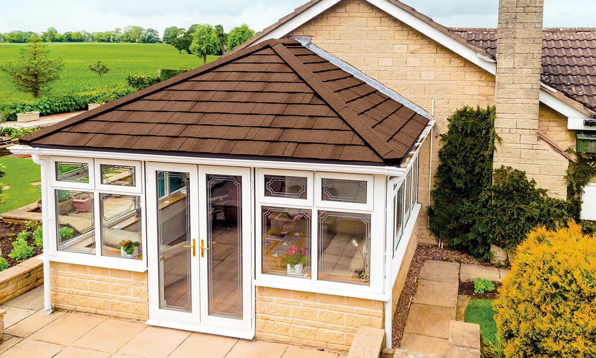 White uPVC conservatory with a tiled roof