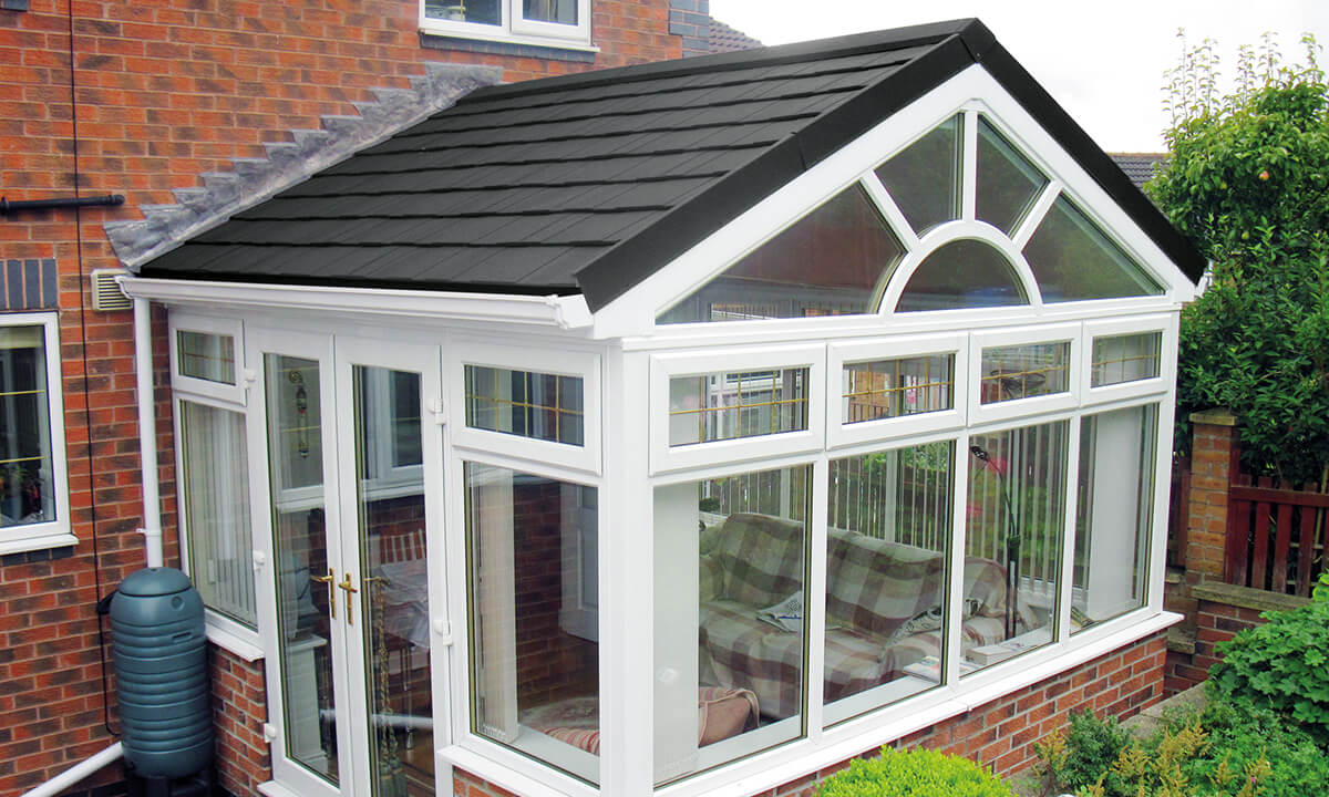 uPVC gable conservatory with a grey tiled roof