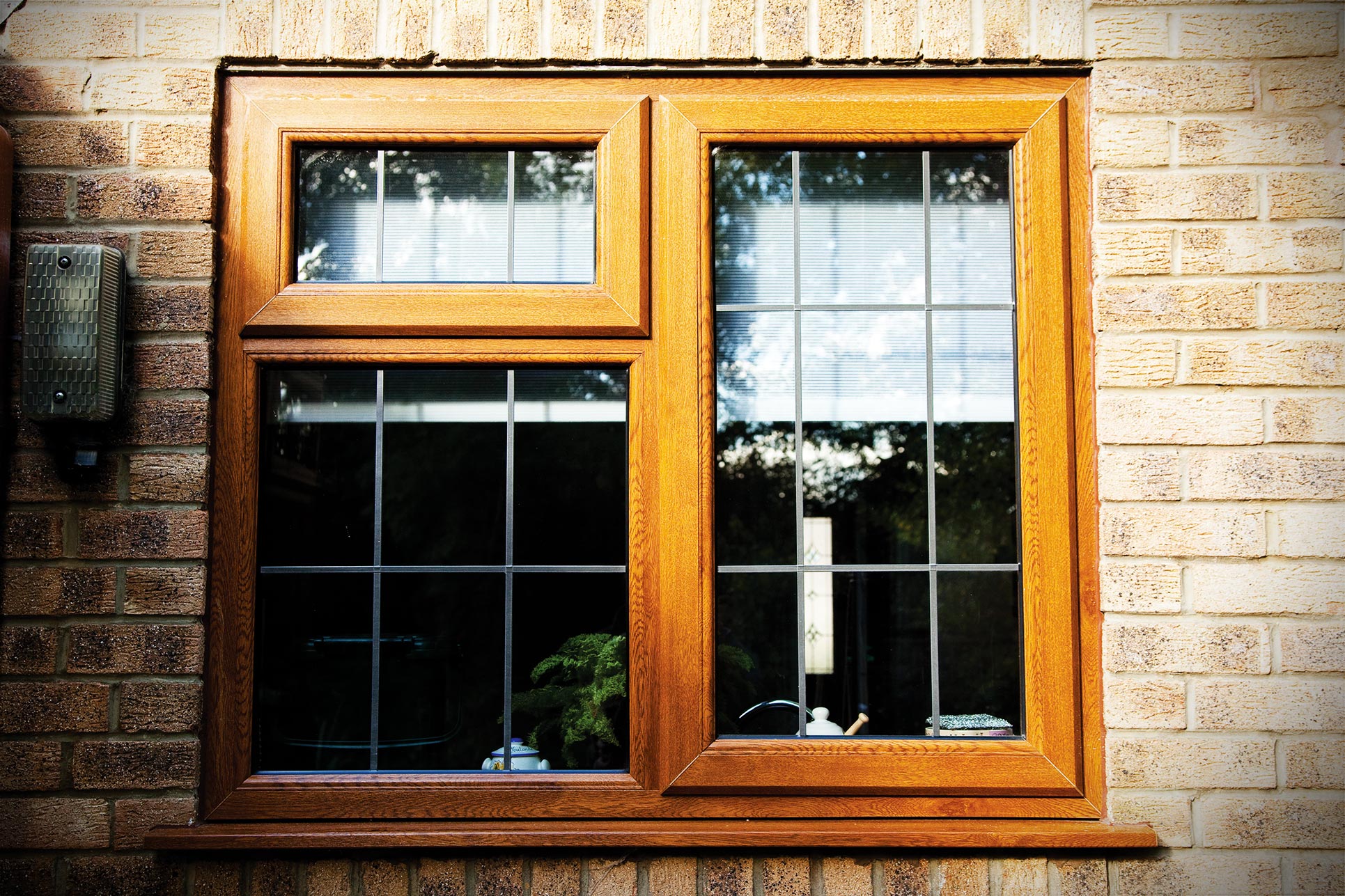 Golden oak effect uPVC leaded casement window